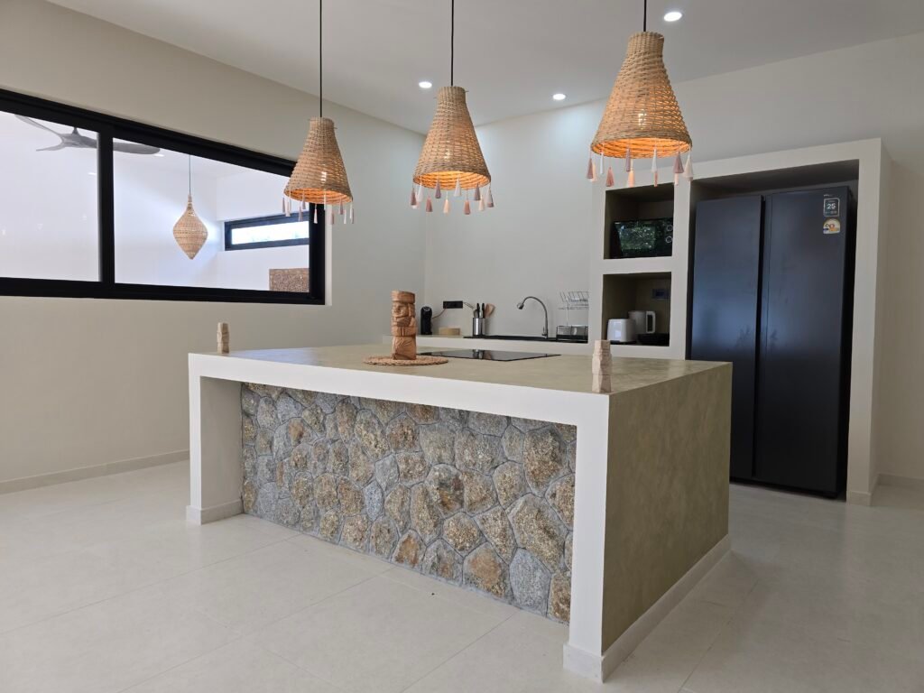 kitchen with stone-clad central island in a luxury villa