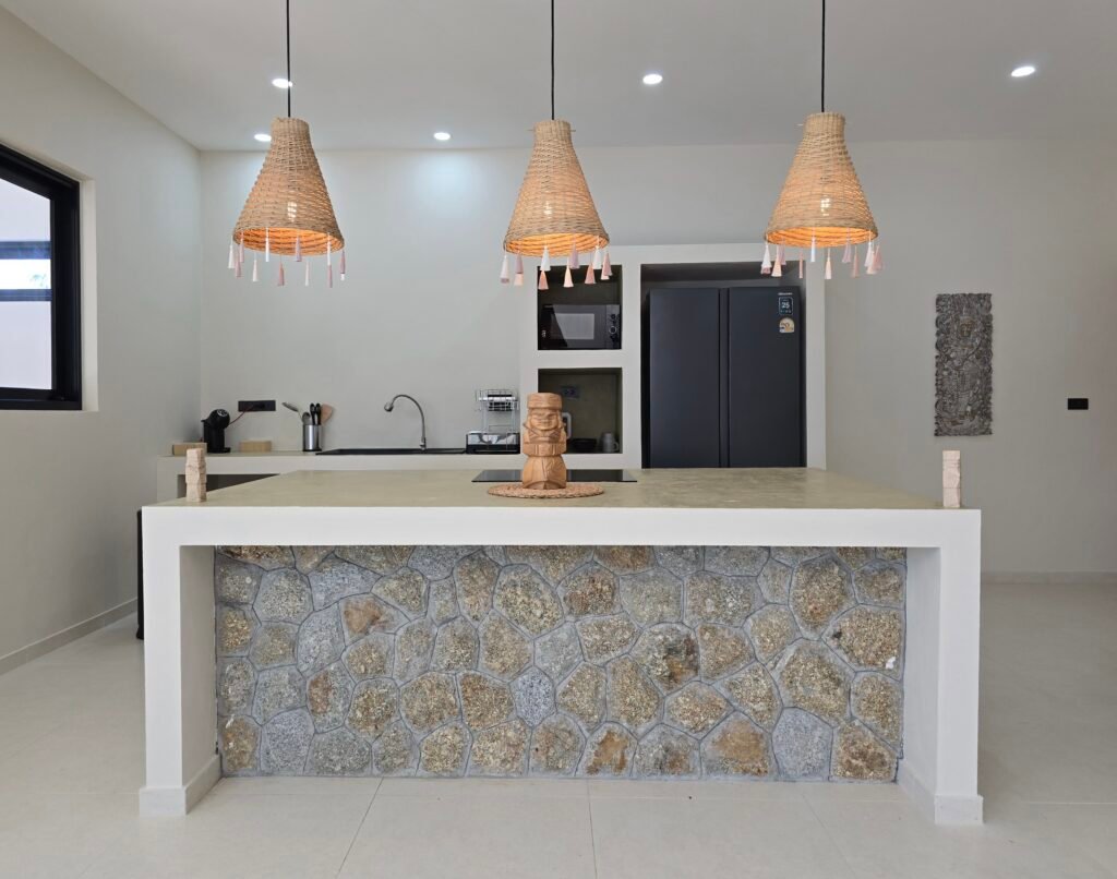 kitchen with stone-clad central island in a luxury villa