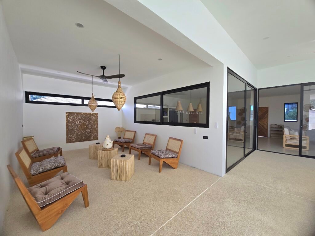covered terrace with wooden furniture in a luxury villa