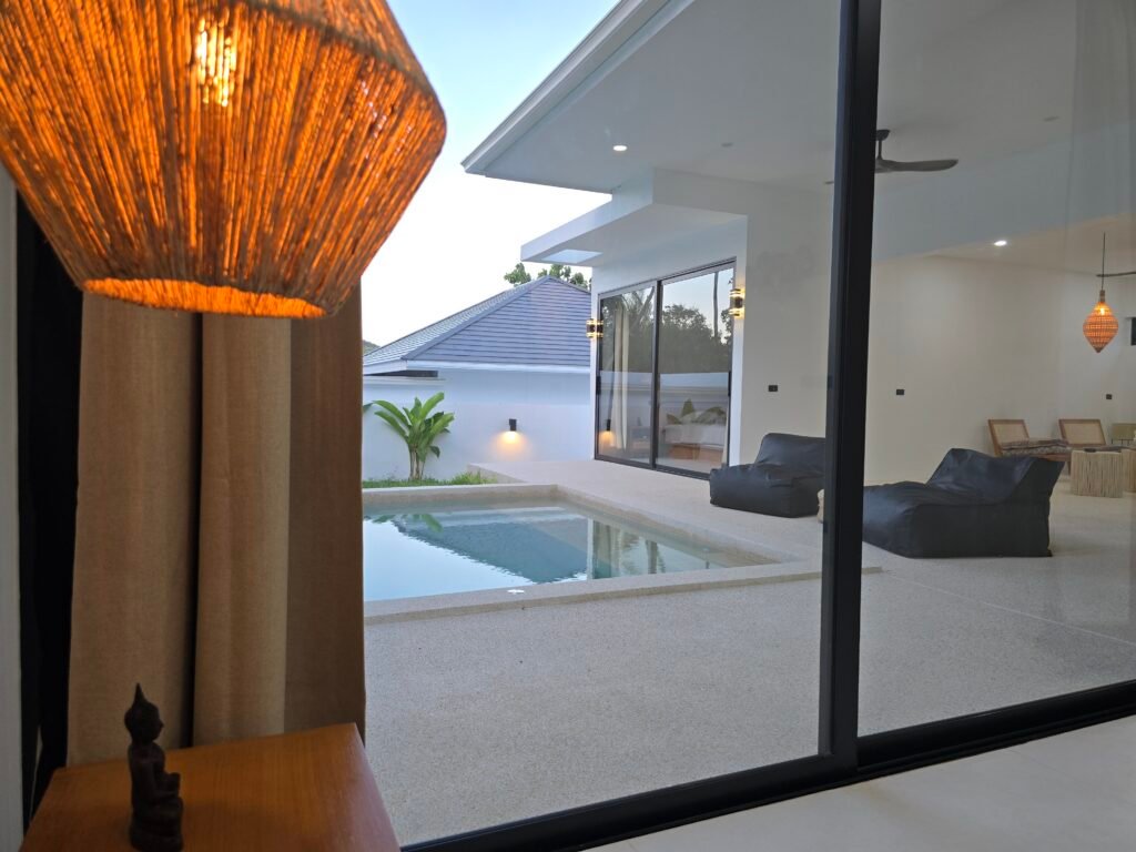 Pool view from a bedroom in a luxury villa